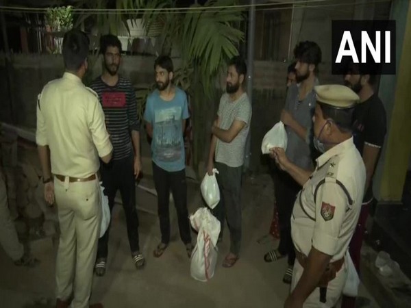 Police provided food for stranded Kashmiris in Assam on Monday night. 