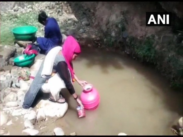 Villagers drawing water from the polluted nullah in Kathua, Jammu and Kashmir