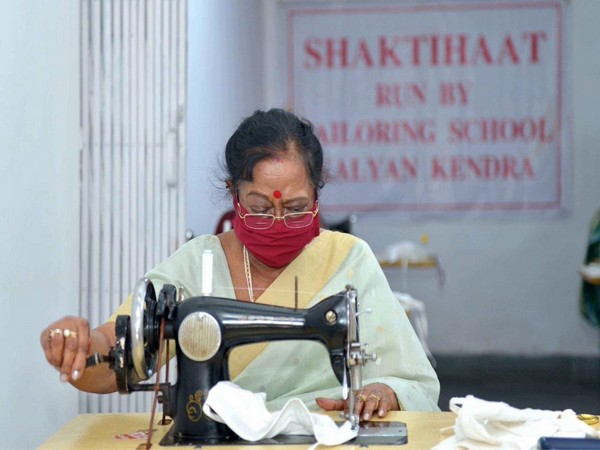 First Lady Savita Kovind stitching masks for shelter homes. Photo/ANI
