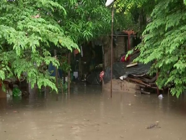 Houses adjoining to Mutha river flooded after Khadakvasla dam released water due to heavy rainfall. Photo/ANI