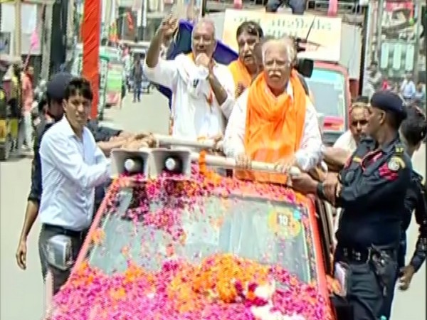 Haryana Chief Minister Manohar Lal Kattar on roadshow in Kurukshetra on Thursday. Photo/ANI