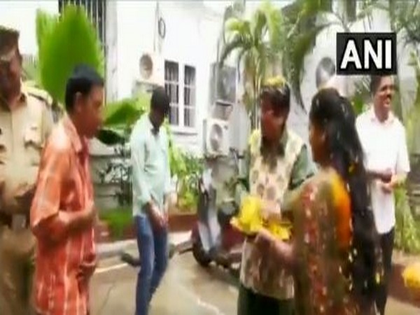 Kiran Bedi plays 'waterless' Holi with Raj Bhawan staff on Tuesday. Photo/ANI