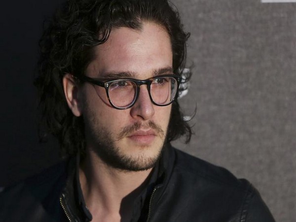 Kit Harington poses for photographers at the Battersea Power Station Annual Party in London