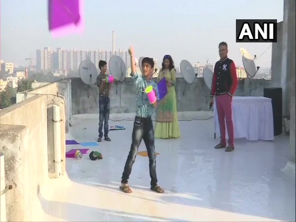 Children flying kites on a terrace on the ocassion of Uttarayan in Ahmedabad, Gujarat on Tuesday Photo/ANI