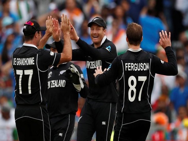 New Zealand players celebrating after taking a wicket in the semifinal against India. 