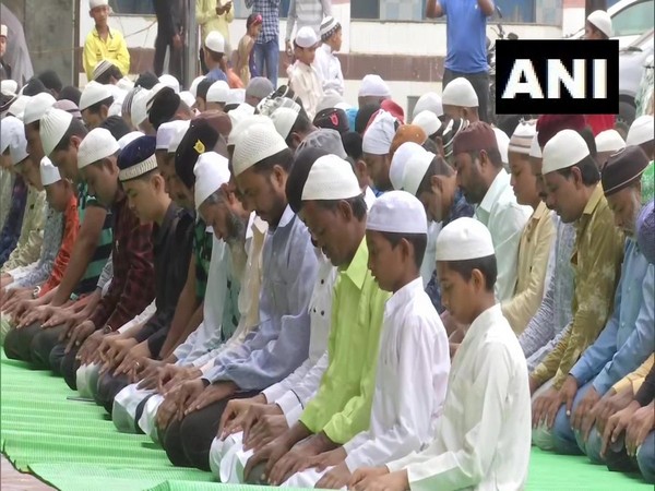 Devotees hug each other after offering namaaz in Shiroli, Kolhapur on the occasion of Eid Al Adha