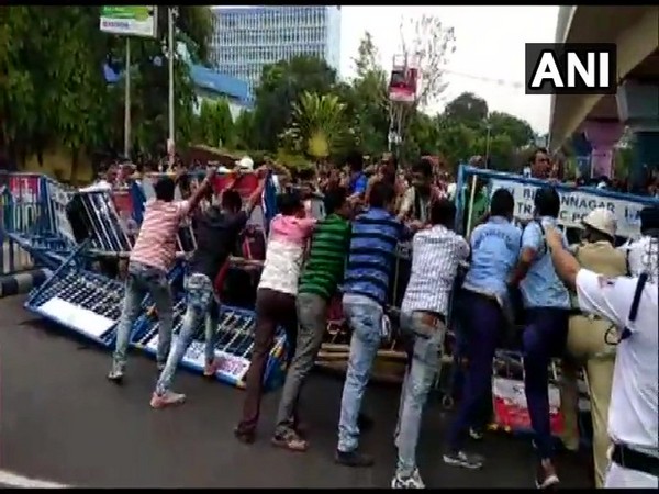 Teachers protest in front of Bikash Bhavan in Kolkata on Monday