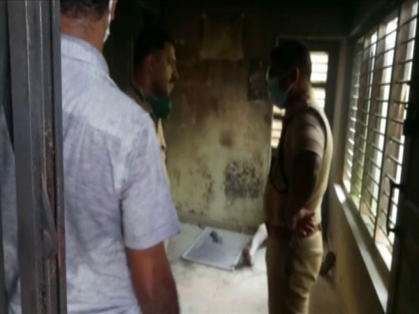 Police officials at the bank in Kollam, Kerala where the woman committed suicide on Wednesday. Photo/ANI
