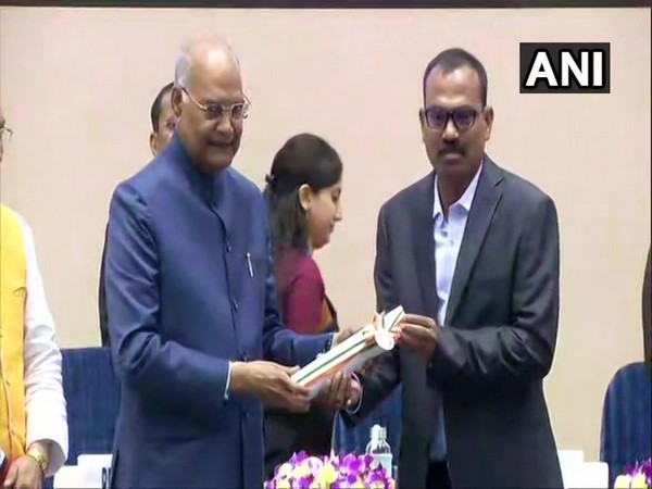 President Ram Nath Kovind presenting National Award to a teacher at Rashtrapati Bhawan on Thursday. (Photo/ANI)