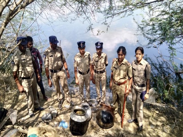Krishna District Police seizing country liquor during raids on Wednesday. Photo/ANI