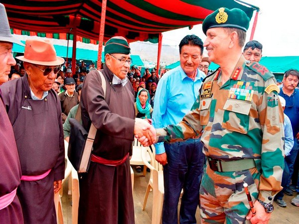Lieutenant General YK Joshi interacting with attendees at ex-servicemen rally on Wednesday. Photo/ANI