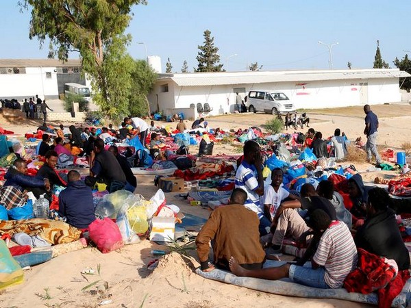 Migrants are seen with their belongings at the yard of a detention centre for mainly African migrants, hit by an airstrike, in the Tajoura suburb of Tripoli, Libya, on July 3