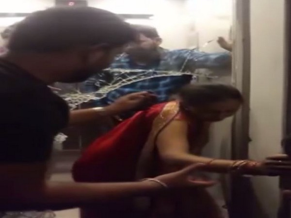 A women being rescued from the lift in a hotel in Patna.