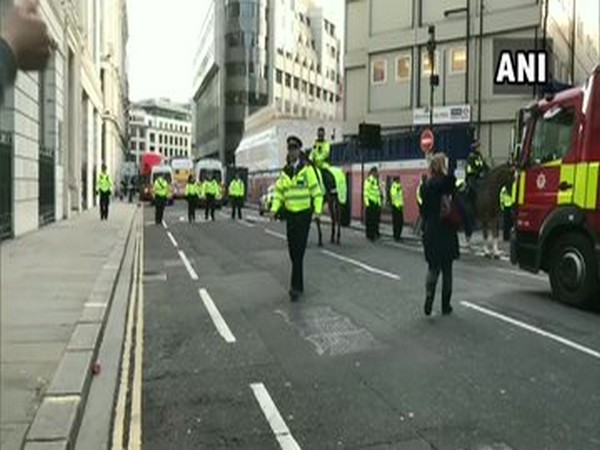 Police at the spot after a male suspect stabbed several people in London Bridge on Friday.