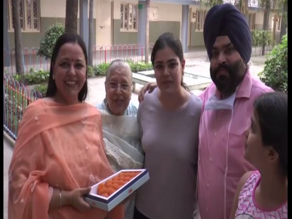 Gurveen Kaur poses with her family for a photograph in Ludhiana on Monday. Photo/ANI