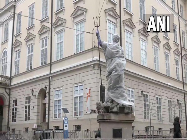 Statue of Neptune covered at Rynok square in Lviv.  