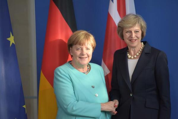 May gets Merkel's backing in not triggering Brexit this year