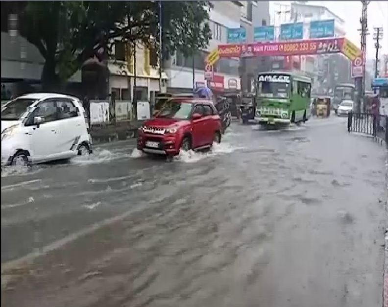 MG Road in the city was flooded due to heavy rains. Photo/ANI