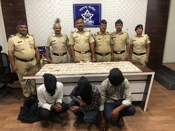 Visuals of three accused with seized currency. 