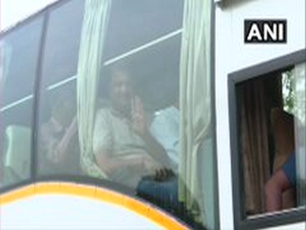 Congress MLA while posing from the bus, which leaves for Ratnagiri on Friday morning. Photo/ANI