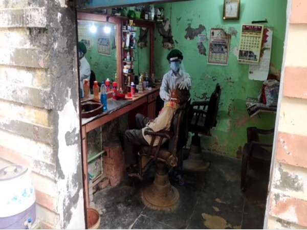 Barber shops reopen in UP's Moradabad amid #Unlock1. (Photo/ANI)
