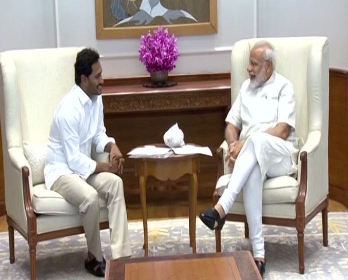 Prime Minister Narendra Modi (left) while interacting with designate Chief Minister of Andhra Pradesh Jaganmohan Reddy (right) in his residence at Lok Kayan Marg, New Delhi. Photo/ANI