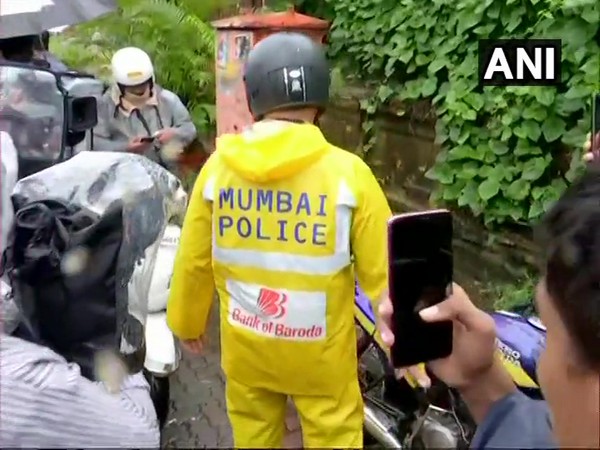 Mumbai police official at late actor Sushant Singh Rajput's Bandra residence. (Photo/ANI)
