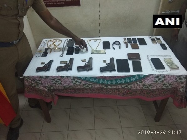 Pistols and other things seized from occupants of the car by police. Photo/ANI