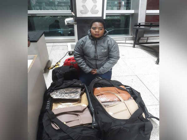 The accused with siezed drugs at IGI Airport in New Delhi Photo/ANI