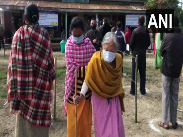 An elderly woman coming out from a polling booth in Imphal after casting her vote on Saturday.