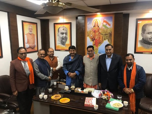 Delhi BJP chief Manoj Tiwari with newly elected MLAs at the party headquarters.