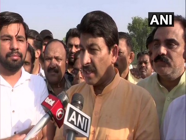 BJP MP Manoj Tiwari speaking to reporters in Delhi. 