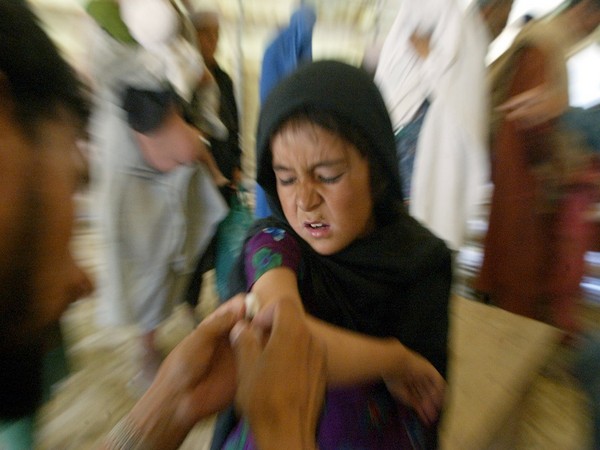A young Afghan refugee girl being vaccinated against measles. (Photo Credit - Reuters)