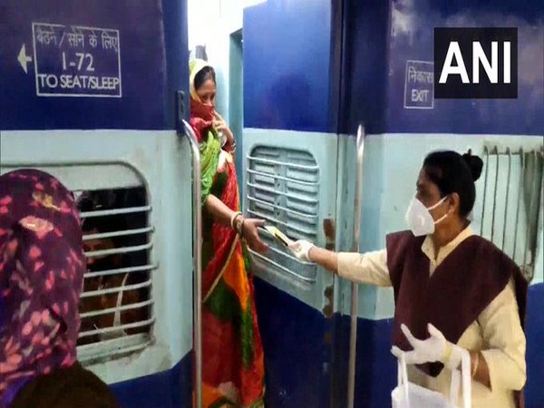 Employees of Indian Railways distributing sanitary pads. (Photo/ANI)