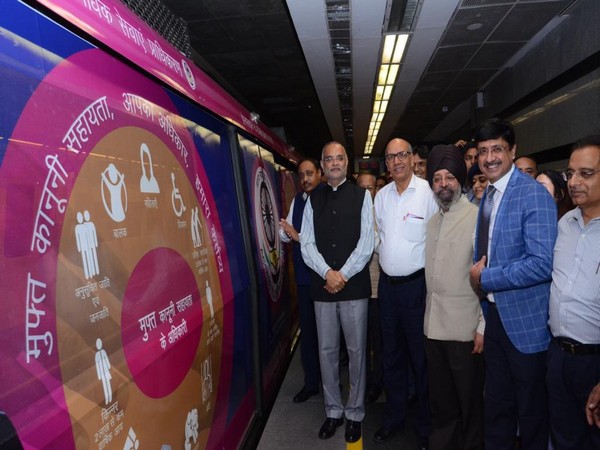 Chief Justice of Delhi High Court Dhirubhai Naranbhai Patel (wearing black waistcoat) flagging of ad-wrapped train from Dwarka Sector 21 on Saturday. 