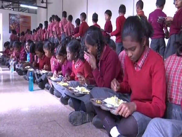 Children eating the mid-day meal in Adani Vidya Mandir in Chhattisgarh.