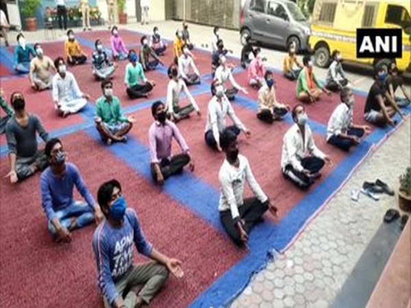 Migrant workers at a yoga session in Moradabad, Uttar Pradesh