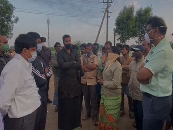 Andhra Pradesh Irrigation Minister P Anil Kumar (in black) Saturday visited flood-affected areas in Nellore.