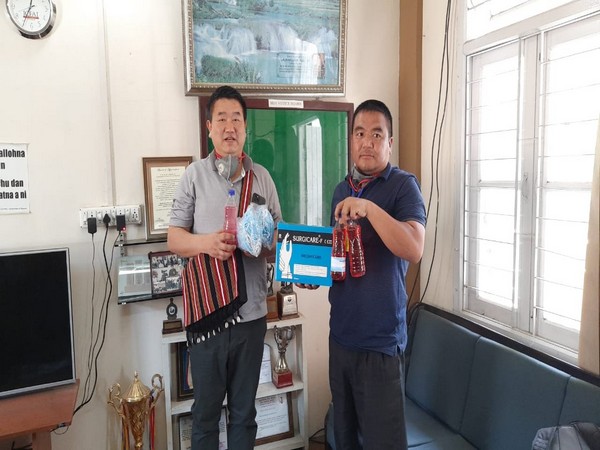 Minister Lalruatkima distributes sanitisers, gloves and masks to the Mizoram Journalists Association. Photo/ ANI