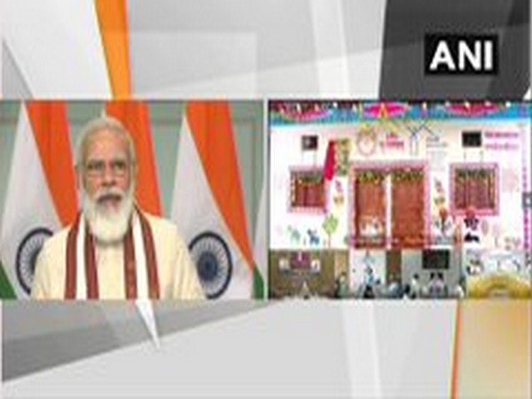 Prime Minister Narendra Modi speaking at the inauguration of houses built under PM Awas Yojana-Gramin in MP on Saturday. Photo/ANI