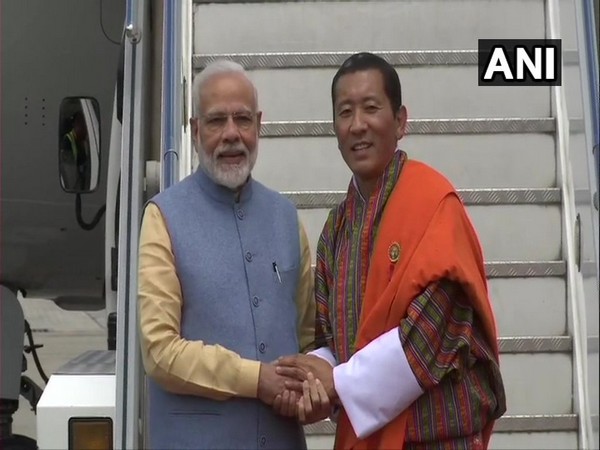 Prime Minister Narendra Modi received by his Bhutanese counterpart Dr Lotay Tshering at the Paro International Airport on Saturday.