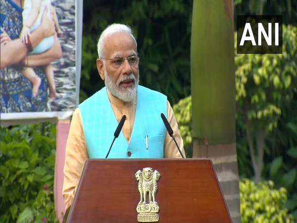 Prime Minister Narendra Modi addressing representatives of RWAs of Delhi's unauthorised colonies and others at his residence in New Delhi on Friday.