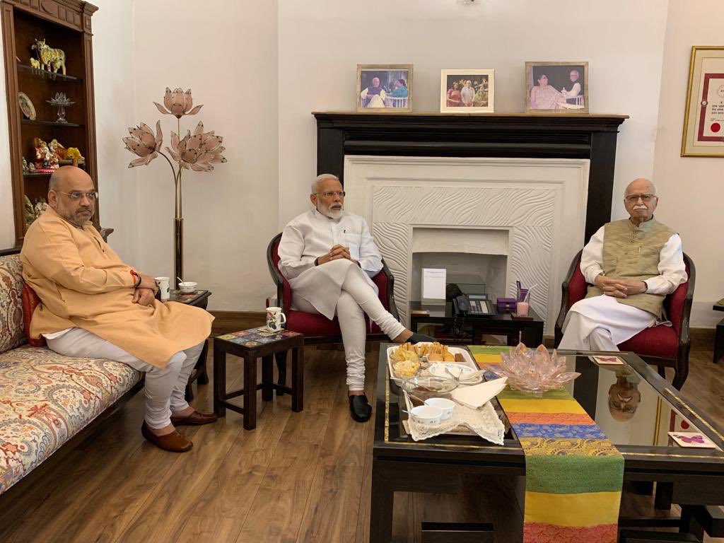 PM Narendra Modi and Amit Shah at veteran BJP leader LK Advani's residence in New Delhi on Friday. (Photo Credits: Narendra Modi's Twitter)