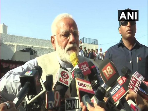 Prime Minister Narendra Modi speaking to reporters after casting his vote in Ahmedabad on Tuesday.