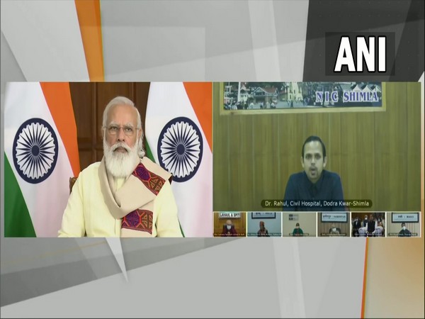 PM Narendra Modi interacts with healthcare workers & beneficiaries of COVID vaccination programme in Himachal Pradesh via video conferencing. (Photo/ ANI)