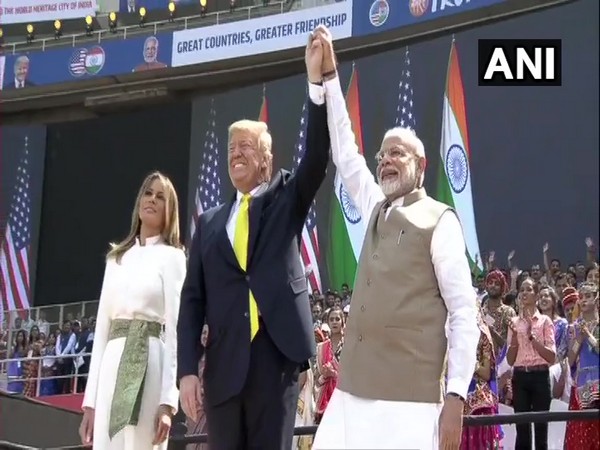Prime Minister Narendra Modi and US President Donald Trump hold hands at Motera Stadium in Ahmedabad on Monday.