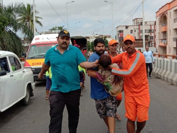 Mukesh Singh helped the woman who was trapped in a water-logged area.