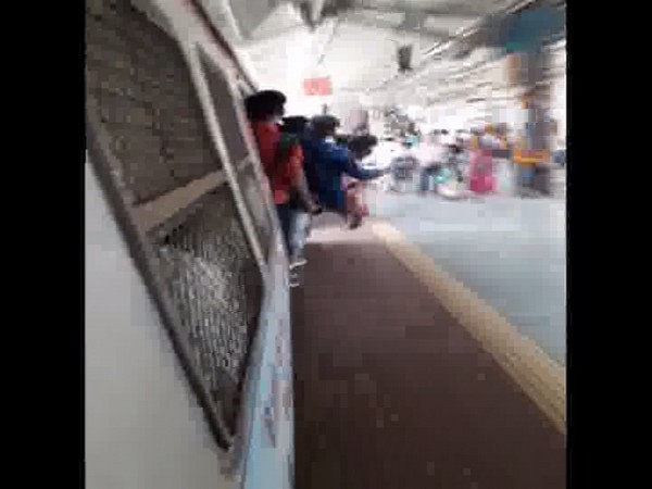 Minor boys performing stunts on Mumbai local train
