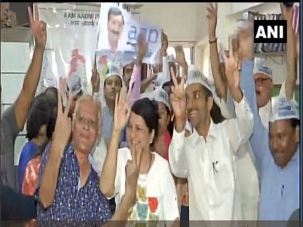 Aam Aadmi Party workers in Mumbai's Andheri celebrate the party's performance