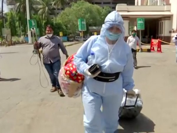A passenger arrives at the railway station in Mumbai. Photo/ANI